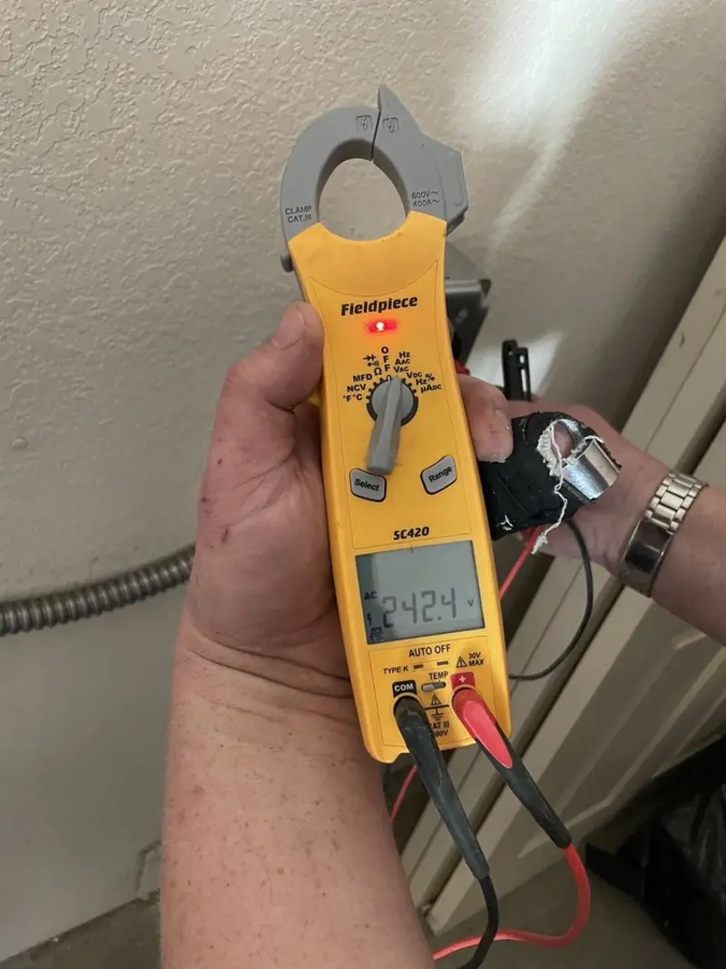 Voltage testing with clamp meter during Generator Installation in Lake Arrowhead